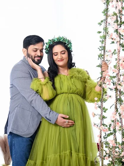 A sweet and candid moment between the couple on our floral swing. The lime green gown adds a fresh and vibrant feel to this romantic shot.