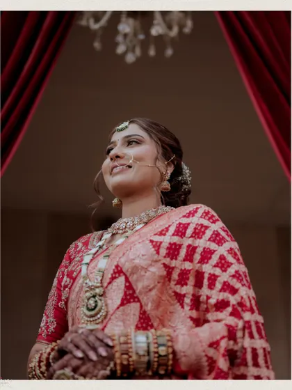 A low-angle shot of the bride looking up, her expression full of hope and happiness.