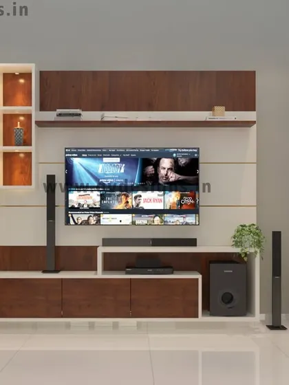A full view of the TV unit and living room partition. The design provides ample storage and display space, with dedicated spots for speakers, creating a functional and aesthetically pleasing entertainment zone.