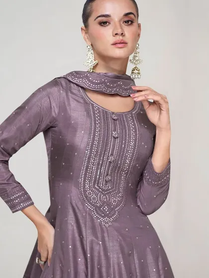 This dusty purple premium silk gown is modern and chic. The unique neckline and subtle sequin work make it a sophisticated choice for any formal event.