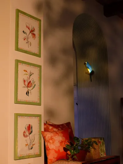 A trio of my custom floral wall art, framed in green, adds a touch of charm to this cozy nook. The soft, botanical illustrations are perfect for creating a relaxed and personal atmosphere.
