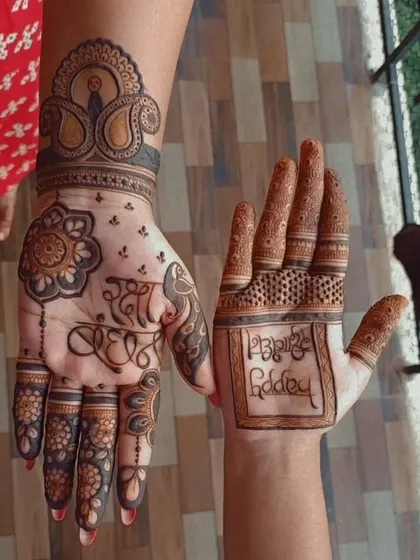 A personalized Rakshabandhan design with "Rakhi Bandhan" written in beautiful calligraphy on one hand and "Happy Rakshabandhan" on the other.