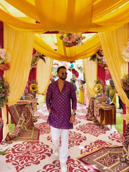 A stylish entry into a beautifully decorated Haldi event. My personal style is part of my performance, ensuring I look the part for your grand celebration.