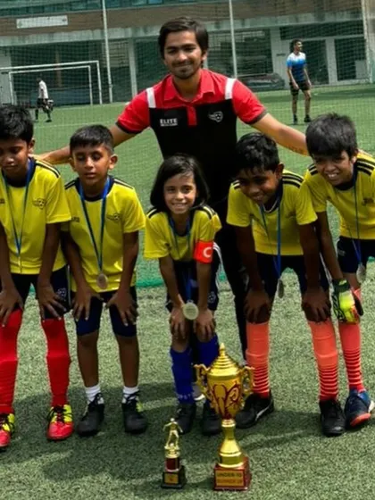 The U10 runners-up team with their coach after the BEL Cup final.