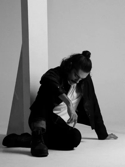 A contemplative, seated pose from the 'Blaze of Glory' series.