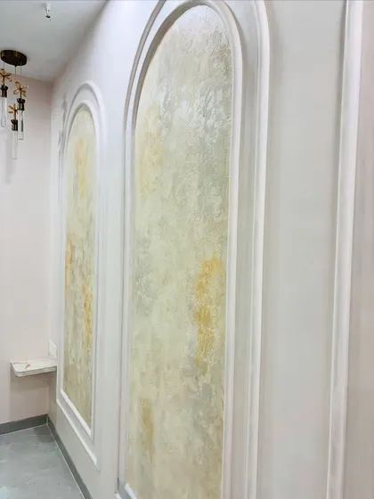 A close-up of the hand-applied texture paint within the POP moulding, showing the beautiful variations in color and texture.