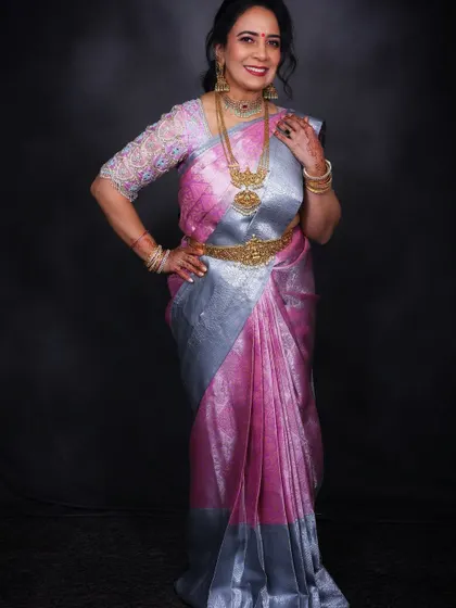 Confidence and grace personified. This image captures the full effect of the makeover, from the elegant hairstyle to the perfectly pleated saree.