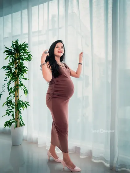 Looking towards a bright future. This mom-to-be, bathed in soft window light, looks so hopeful and beautiful as she awaits her new arrival.