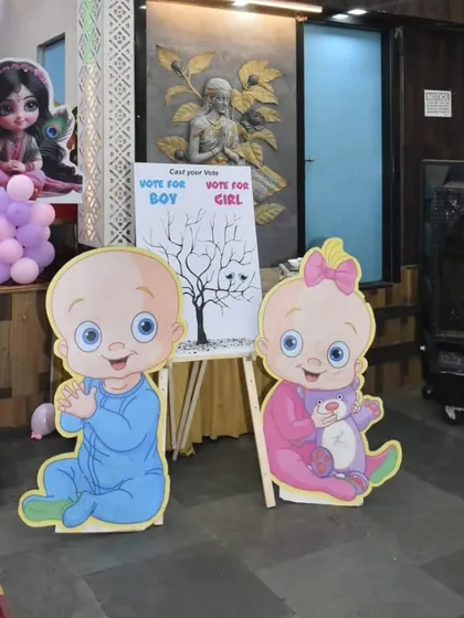 A fun and interactive corner for guests. This easel invites everyone to cast their vote for 'Boy or Girl', adding to the excitement.