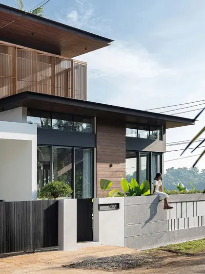 The design thoughtfully provides spaces for informal interaction, like this boundary wall where one can sit and engage with the street.