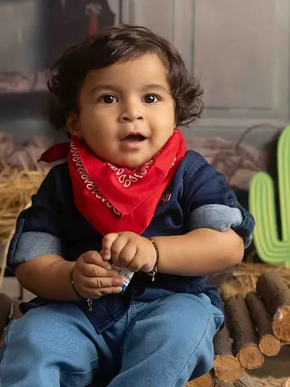 A close-up of our little cowboy, full of curiosity and charm.