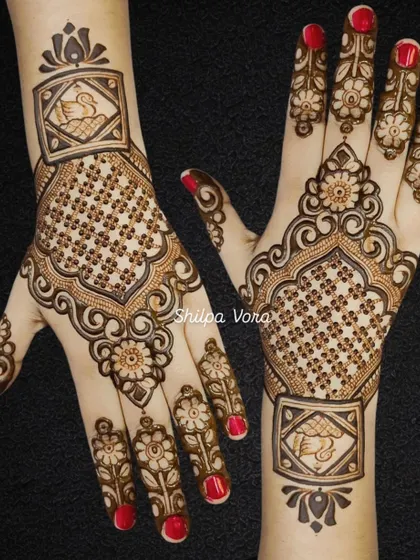 The same beautiful swan design for Teej, shown against a dark background to highlight its intricate details.