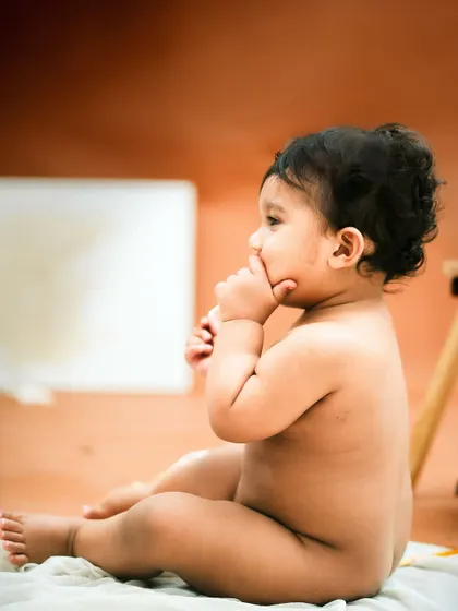 A thoughtful moment with a paintbrush in hand. This session was all about capturing his natural curiosity.