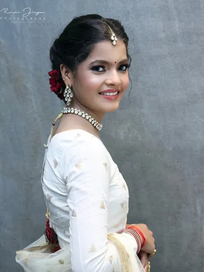 A final portrait showing her looking over her shoulder, giving a great view of the hairstyle and makeup.