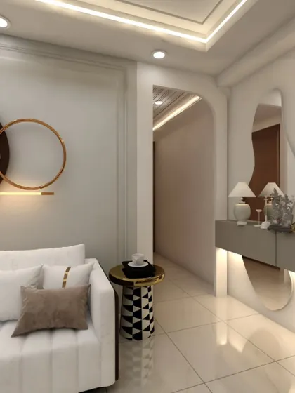 An entryway console designed with a modern, asymmetrical mirror and subtle backlighting. This area, leading into the living room, features a Buddha statue to create a tranquil first impression.