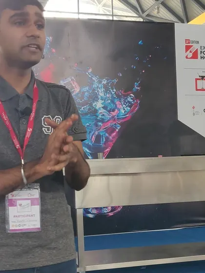A participant presenting his concept during a mixology championship. These events are a fantastic platform for bartenders to showcase their creativity.