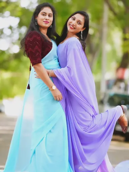 A fun and playful pose with the blue and lavender trail sarees.