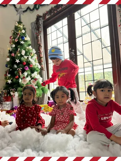 A group of children enjoying the festive Christmas setup. We create a magical atmosphere where they can celebrate and make memories together.