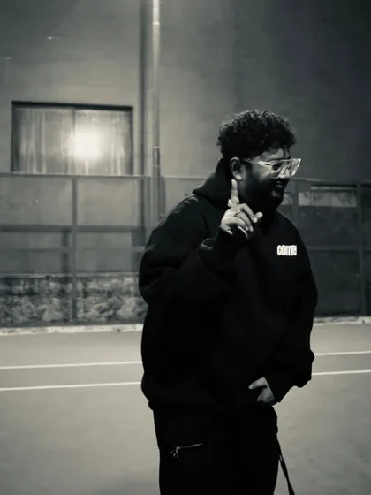 A black and white shot from the "CONTRL" promo. The focus is always on the next move.