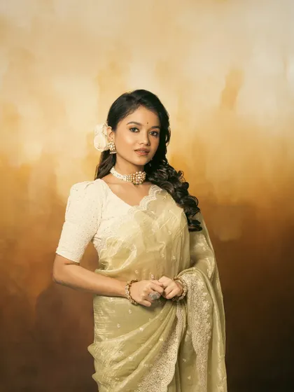 A full-length shot of Sanjana, looking graceful and elegant in the complete retro ensemble.