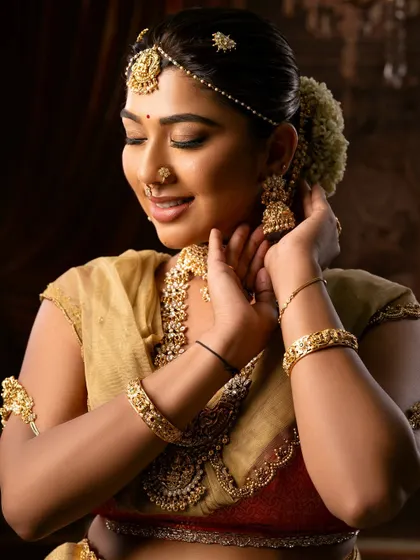 A happy bride is the most beautiful bride. This close-up captures her joy and the flawless finish of her makeup.