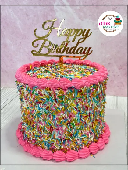 A fun and festive birthday cake covered entirely in colorful sprinkles. The bright pink piping adds an extra pop of color to this cheerful design.