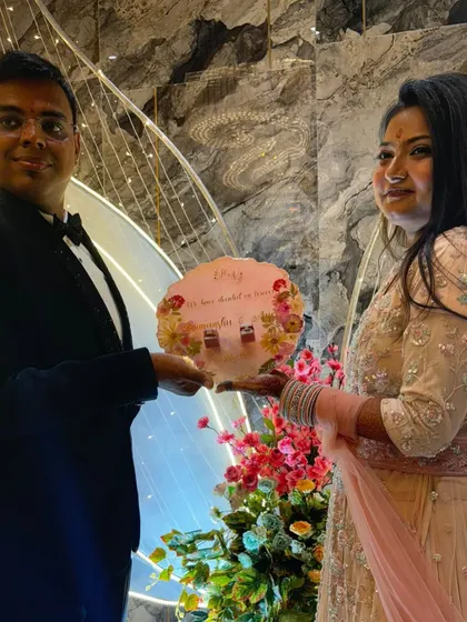 The happy couple with the custom engagement ring platter I made for them. It brings me so much joy to see my work in its new home, celebrating their love.