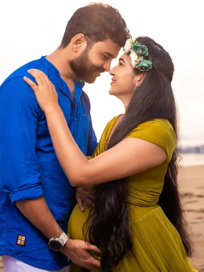 An intimate close-up of the couple, their happiness radiating against the soft backdrop of the beach.
