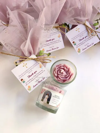 A close-up of the packaged Holy Communion favor, showing the personalized card and elegant net wrapping.