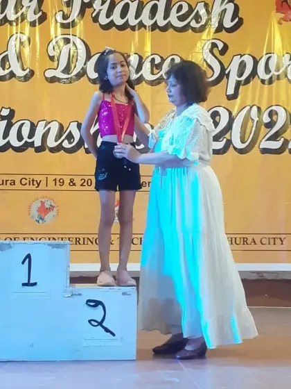 Here is Ipsha on the podium receiving her silver medal at the UP State level Dance Sports Championship. A proud moment for all of us.