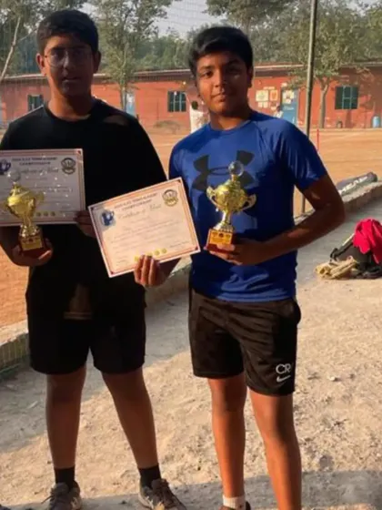Our U-14 doubles runners-up, Arjun and Aarav, after their match. Teamwork and strategy are key components of our doubles coaching.