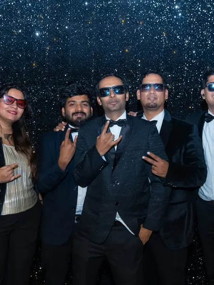 The band, dressed in tuxedos, posing for a shot during a "Great Gatsby" themed New Year's Eve party. We adapt our style to fit the theme of any high-profile event.