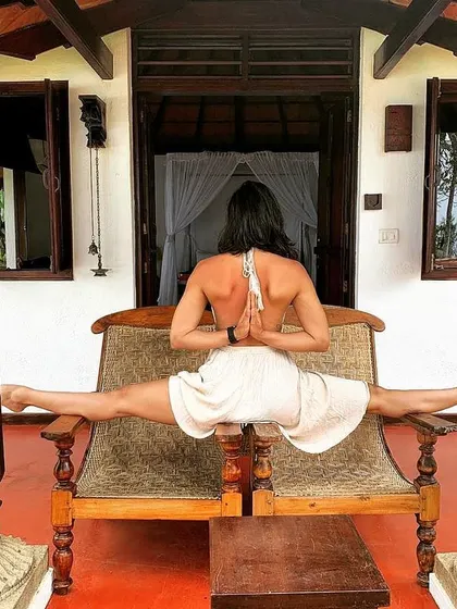 A different perspective on the split. Here I am in Hanumanasana with my hands in a reverse prayer position, which adds a shoulder-opening element to the deep hip stretch. It’s all about finding new challenges on the mat.