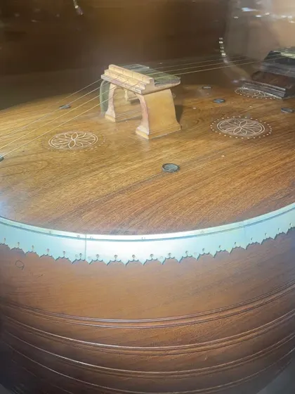 A close-up of a fascinating historical veena I saw at the Venkatappa Art Gallery. This one from the 1950s or 60s has small resonators on the top board, a feature I had never seen before.