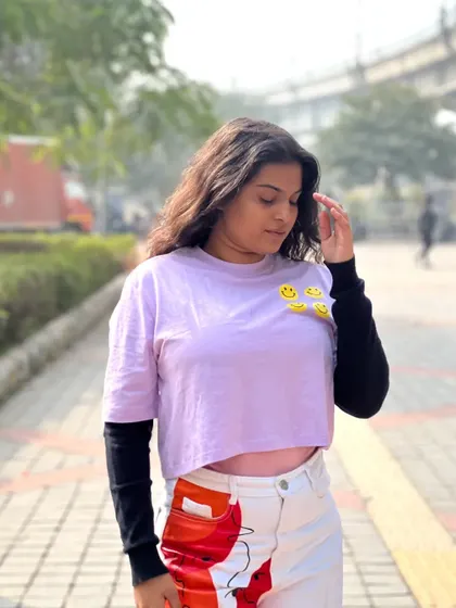 Another angle of the layered top, showing the smiley face details. Even in a simple outfit, small details can add a lot of personality and fun.