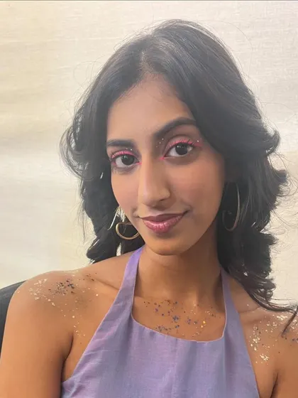 Another fun festival look with a pop of pink liner and body glitter. The goal is to create something playful that expresses the client's personality.