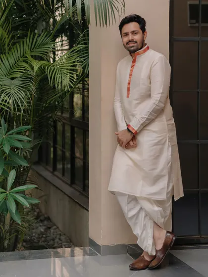 Who says there aren't many choices for an Indian groom? This groom is styled in a classic dhoti and kurta, a nod to his urban Gujarati heritage.