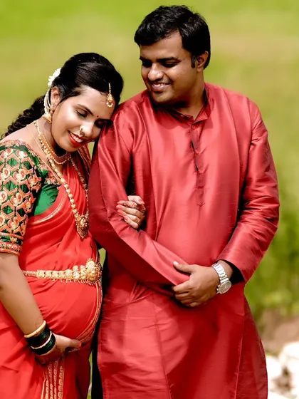 A tender moment captured during the baby shower photoshoot. The traditional makeup and hairstyle complete this picture of happiness.