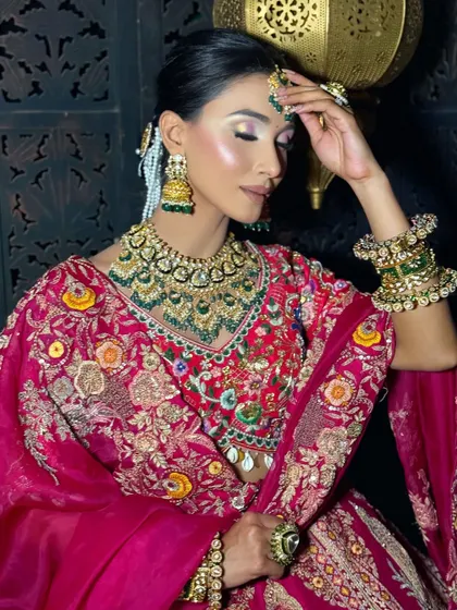 A soft, romantic pose capturing the beautiful eye makeup. The closed eyes reveal a blend of neutral shimmers and a clean liner, a versatile look that complements any traditional bridal outfit.