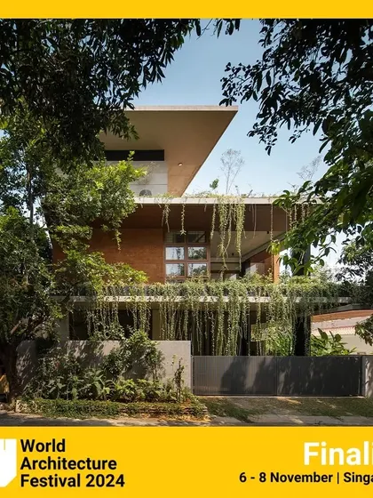 The 'House of Greens' seen through the trees, almost camouflaged by its natural surroundings. This image was part of our finalist submission for the World Architecture Festival.