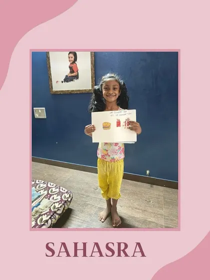 Sahasra with her fun food illustration. Art gives children a sense of achievement and helps build confidence in their work.