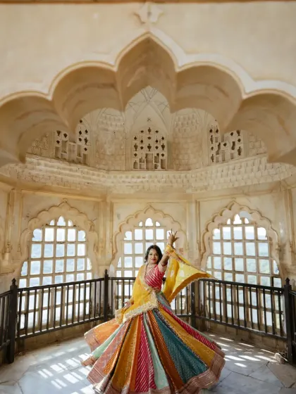The bride's joyful twirl fills this ornate chamber with energy and color. I love using these architectural details to frame solo portraits that are full of life and personality.