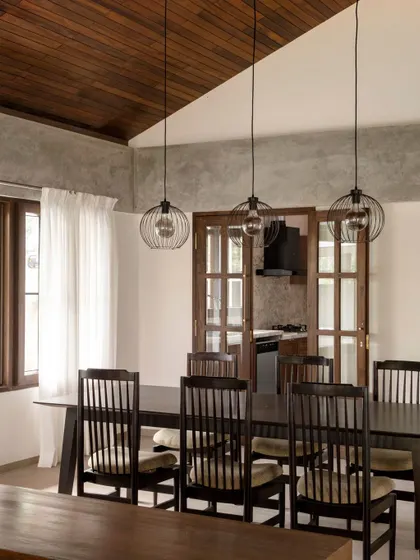 In the Polibetta Farmhouse, we upcycled rafters from the old house to create a new false ceiling. This sustainable practice not only reduces waste but also brings a piece of the property's history into the new design.