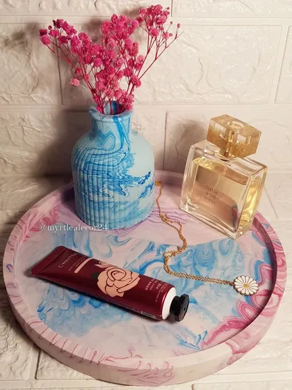 This XL round tray is perfect for organizing perfumes, lotions, and jewelry on a dresser.
