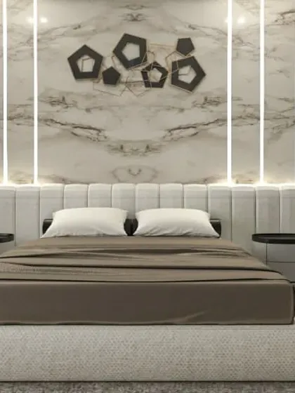 The bed and feature wall from the luxurious bedroom concept, highlighting the interplay of light and texture.