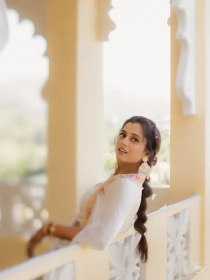 A playful and candid shot of the bride looking back with a smile. These spontaneous moments are often the most cherished.