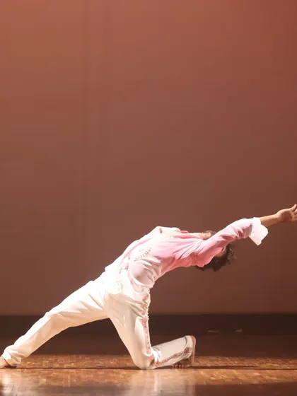 A dancer performs a fluid backbend, showcasing the flexibility and control central to our contemporary dance curriculum.