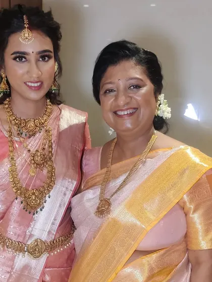 My South Indian bride Ankita with her mother, both looking elegant in their silk sarees.