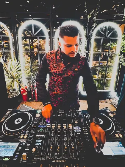 A moody, artistic shot of me at the console. The lighting and my traditional attire for this wedding created a unique and stylish look.