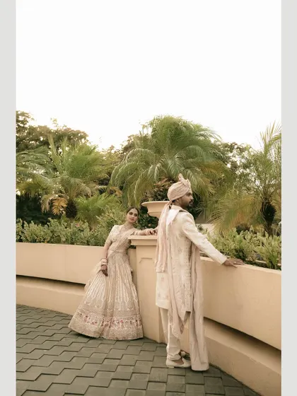 An artistic composition, using the architecture to frame the couple and create a sense of distance and longing.